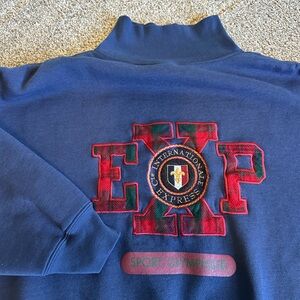 International Express Navy Pullover with Red Plaid Appliqué